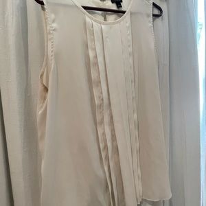 Off white poly sleeveless shell top with pleating down front